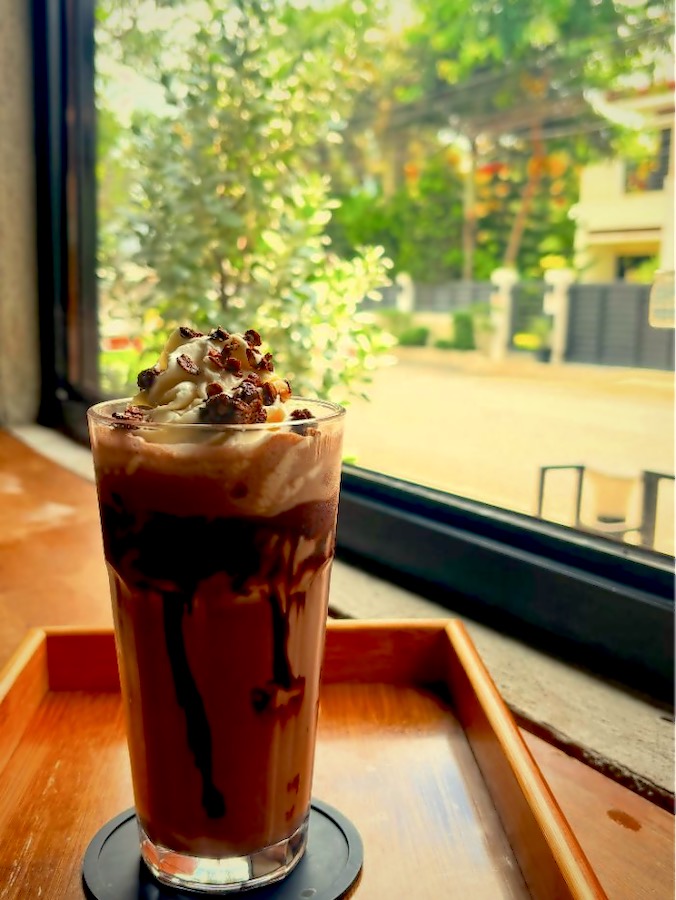 A chocolate frappé by the window