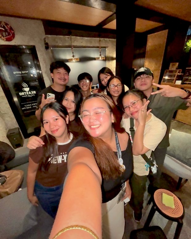 Friends taking a selfie by the door
