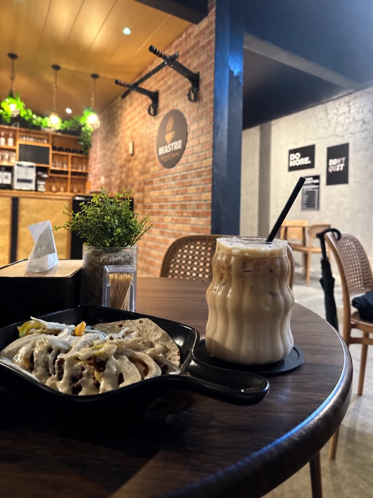 A shawarma plate and an iced latte