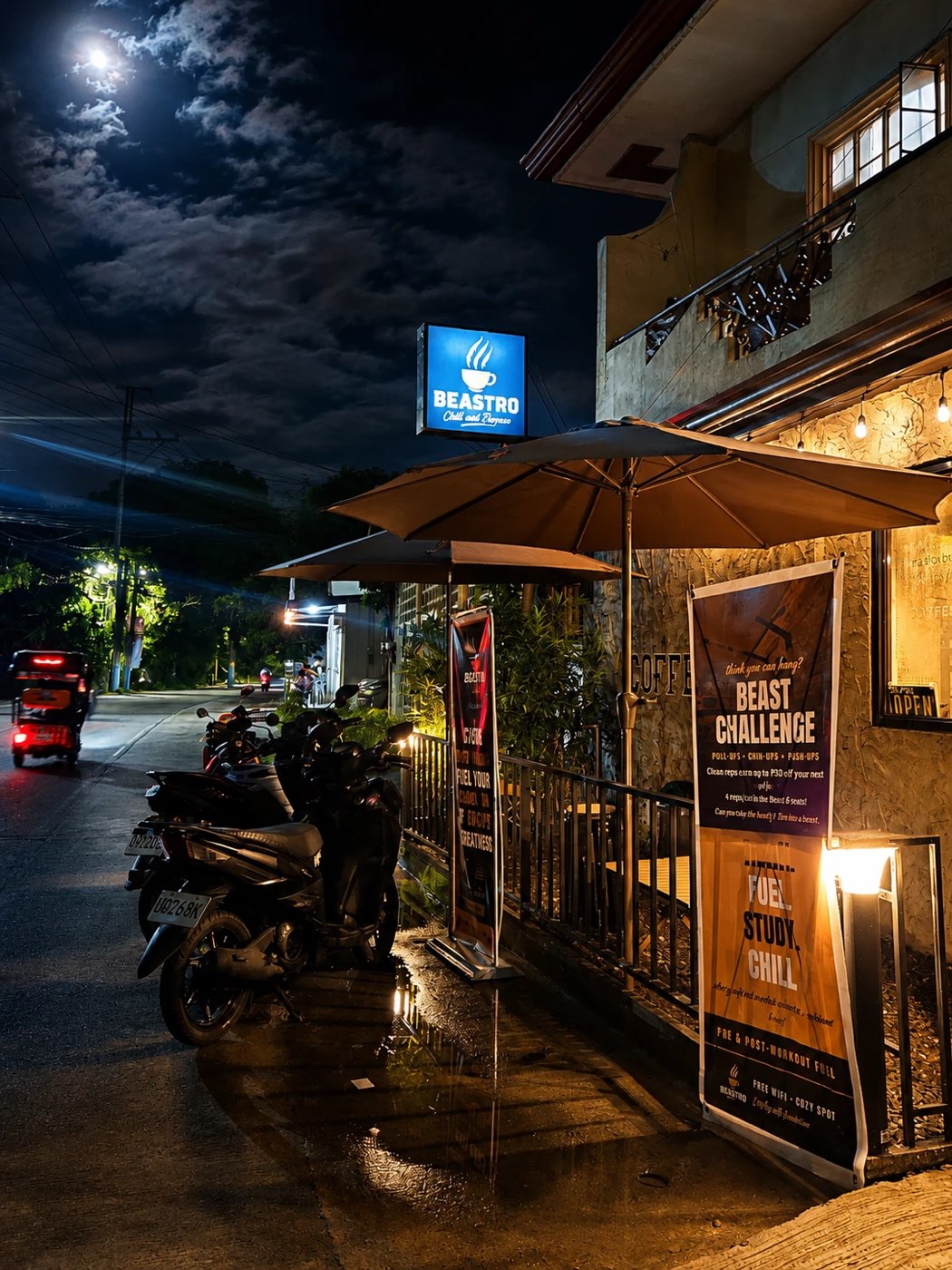 Beastro at night under the moon, umbrellas, string lights and the Beast Challenge banner